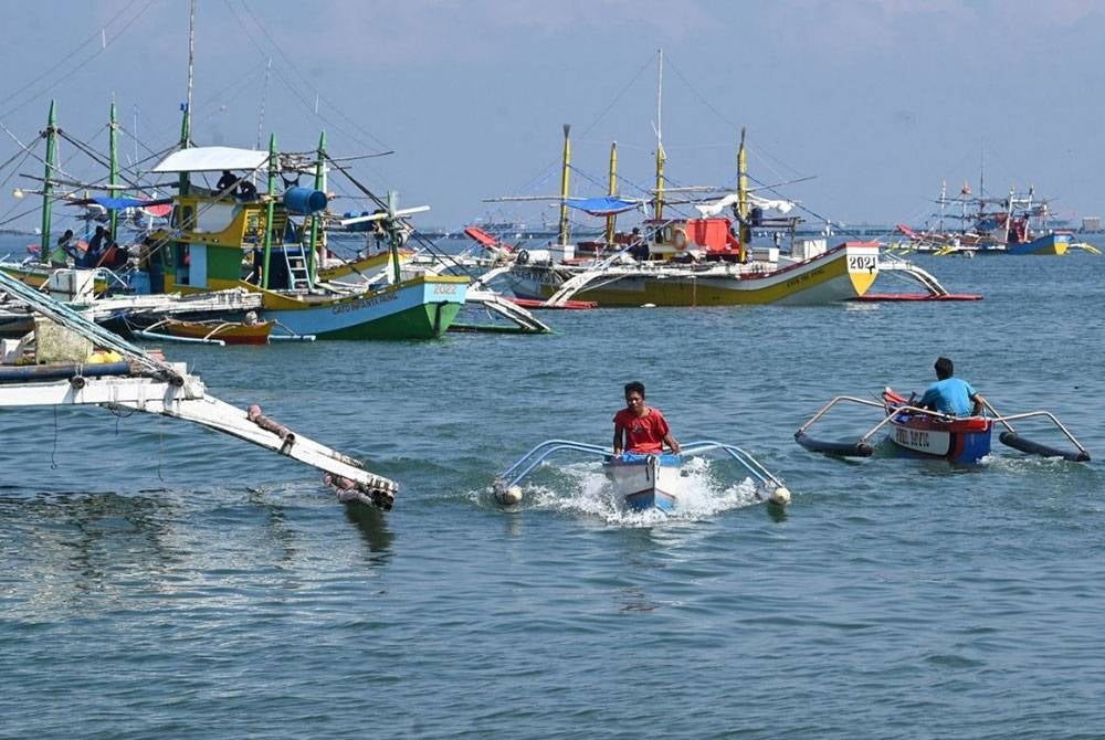 Nelayan-nelayan dari Kampung Cato sebelum ini kerap pergi ke Terumbu Scarborough. - Foto AFP