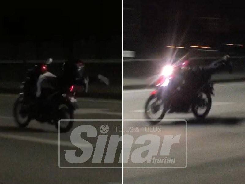 Aksi superman yang dilakukan dua pelakar sekolah menengah yang ditahan dalam Op Lumba Haram di Lebuhraya DUKE, Kuala Lumpur.