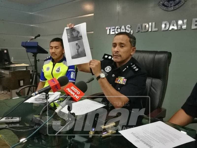 Mohamad Noor Yusof menunjukkan gambar suspek yang berjaya ditangkap melalui cctv di salah sebuah rumah yang terlibat dengan kes tersebut