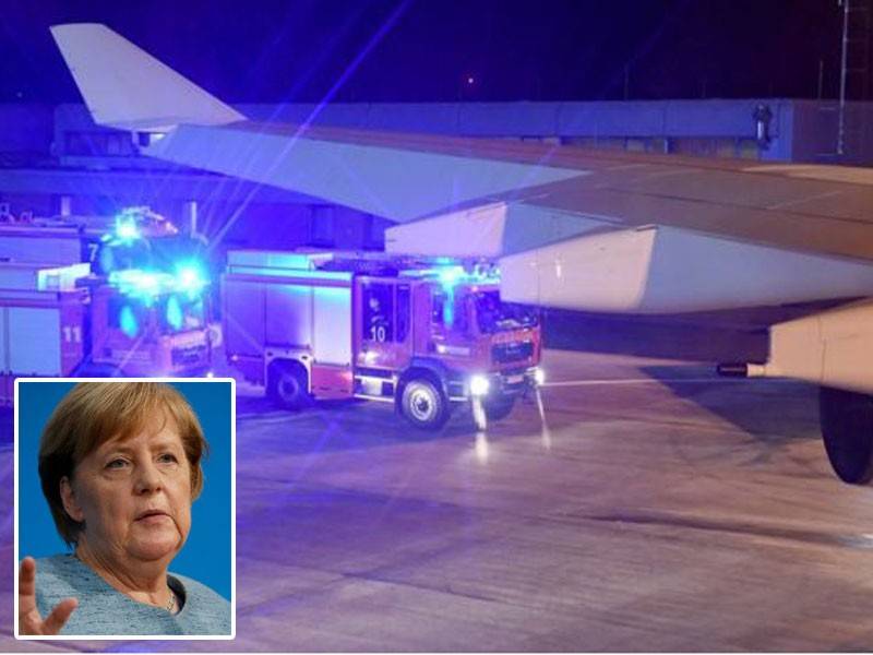 Pesawat tersebut selamat mendarat di Lapangan Terbang Cologne. Gambar kecil: Angela Merkel
