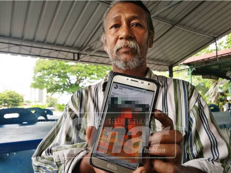 Noor Hasni menunjukkan antara komen menghina yang dimuat naik individu tidak bertanggungjawab dalam media sosial.