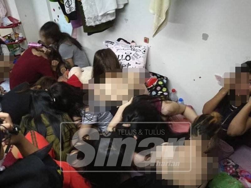 Antara wanita warga asing yang ditahan dalam serbuan di sebuah spa.