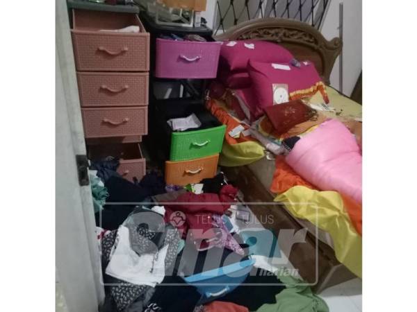 Laci diselongkar pencuri di dalam bilik tidurnya.