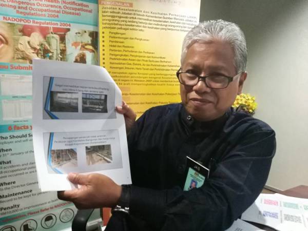 Mohamad Jais menunjukkan kesalahan yang telah dilakukan kontraktor.