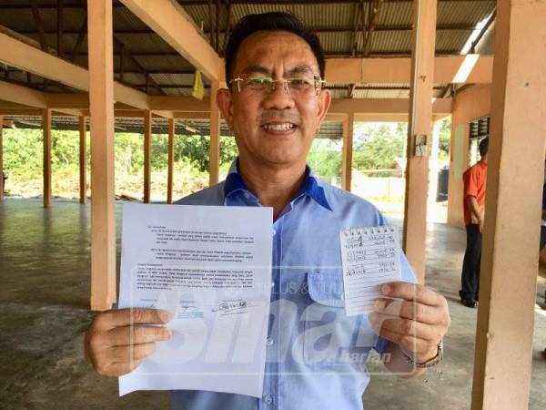 Bendahari Kehormat Pengakap Melaka, Thomas Ong Tai Chu menunjukkan penyata kewangan yang diperolehi setakat ini.