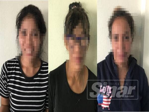 Tiga wanita Indonesia ditahan di Jalan Awam Pulau Ketam, pelabuhan Klang, semalam.