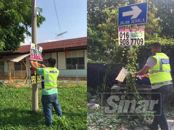 Anggota polis menjalankan operasi Ops Vulture menurunkan bunting iklan ah long sekitar bandar Ipoh.