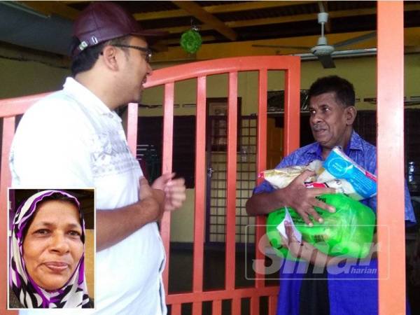 Mohd Rafiq (kiri) ketika menyampaikan sumbangan pada program itu kepada seorang penerima. (Gambar kecil: Jamilah)