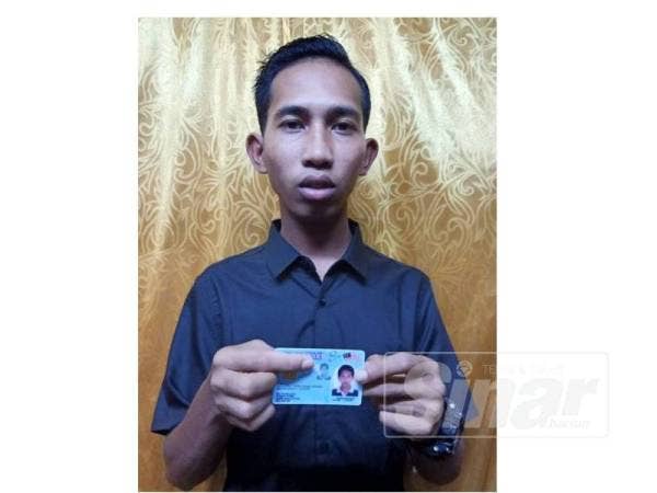 Syawal bersama kad pengenalannya.