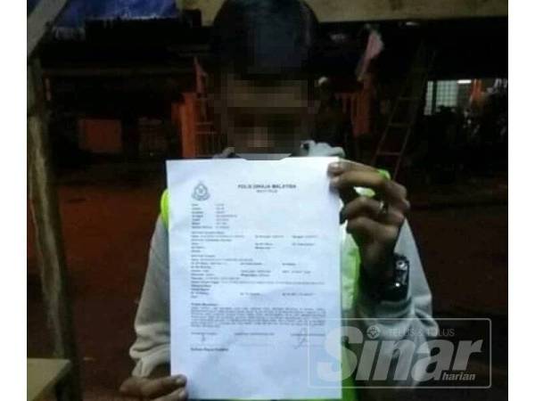 Mangsa menunjukkan laporan polis dibuat susulan disamun oleh dua lelaki bermotosikal Isnin lalu.