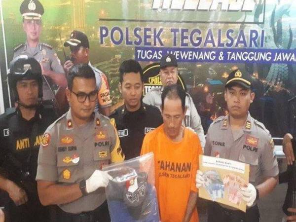M Toyib diberkas polis unit jenayah Tegalsari semalam.