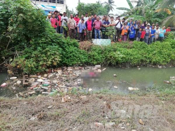 Lokasi penemuan mayat mangsa di sebuah parit besar berhampiran Taman Sri Wangsa hari ini.