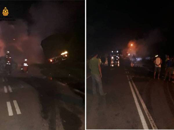 Anggota bomba membantu memadam kebakaran kereta terlibat sebelum mengeluarkan mayat mangsa yang tersepit. - Foto ihsan bomba