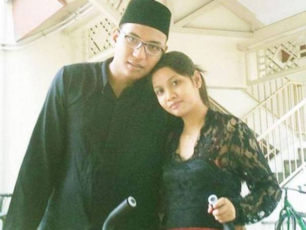 Pasangan suami isteri yang didakwa menyebabkan kematian anak mereka. - Foto The Straits Times