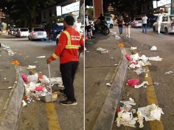Pelbagai jenis sampah termasuk tin dan botol minuman, plastik serta kotak bersepah di jalan raya.