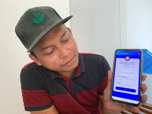 Mohd Zulhairie berjaya membuat penebusan e-Tunai Rakyat