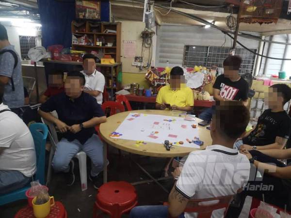 Antara yang ditahan ketika leka berjudi di sebuah kedai kopi di Jalan Paya Terubong, Georgetown.