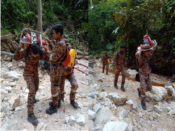 Anggota mengangkut ‘warjet pump’ seberat 8 kilogram secara bergilir-gilir bagi memadam kebakaran hutan. - Foto JBPM Perak