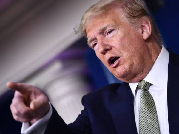 Trump pada mulanya tidak menganggap serius ancaman Covid-19. - Foto Agensi