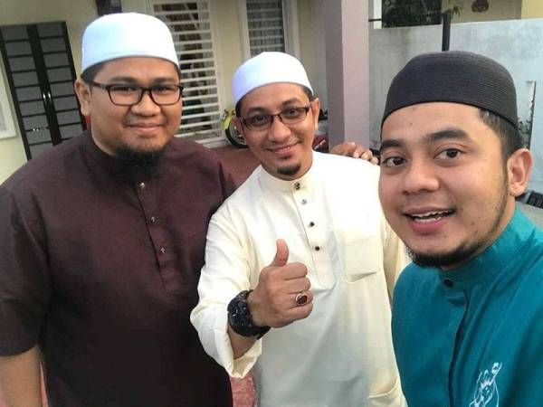 Mohamad Zuhdi (tengah) memilih untuk memaafkan individu yang memfitnah dirinya. 