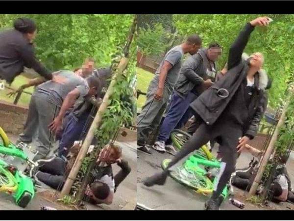 Rakaman video menunjukkan seorang lelaki sibuk berswafoto semasa polis sedang bergelut dengan suspek.