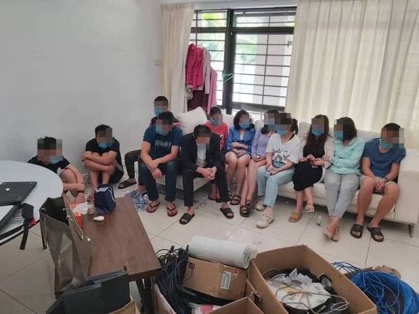 Antara individu yang ditahan dalam serbuan di sebuah rumah di Mutiara Damansara hari ini.