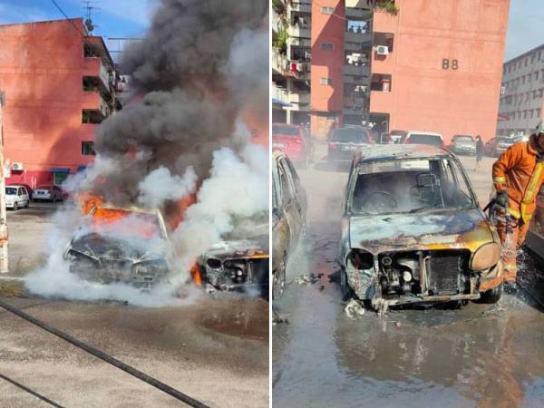 Salah sebuah kereta yang terbakar dalam kejadian di kawasan parkir Flat Taman Bagan di sini pagi tadi.