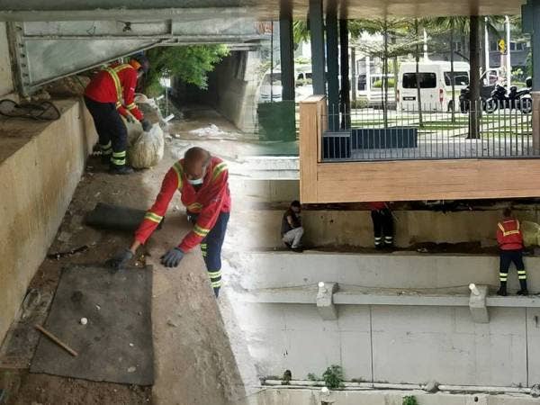 Pekerja Alam Flora membersihkan kawasan di bawah jambatan sepanjang Sungai Gombak di Kuala Lumpur yang menjadi tempat gelandangan tidur.