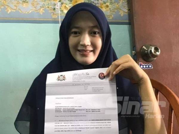 Noor Karmilawatie menunjukkan dokumen perintah mahkamah bagi mencari bapa kandung untuk menjadi wali pada pernikahannya 26 Ogos ini.