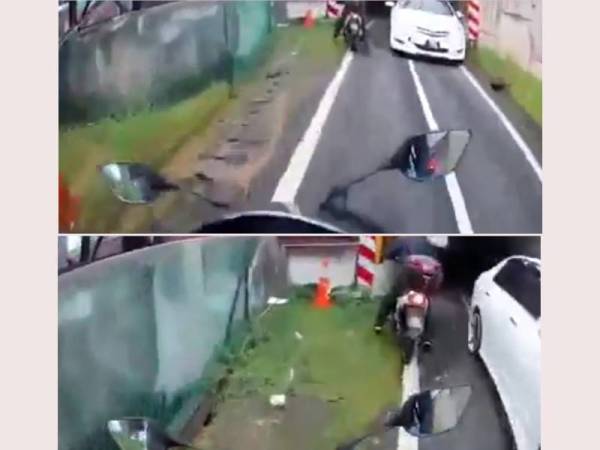Polis giat mengesan pemandu kereta Toyota Vios yang memandu secara melawan arus di laluan motosikal di Lebuhraya Persekutuan berhampiran Angkasapuri, di sini, Rabu lalu.