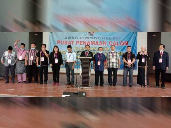 Dr Samuil Mopun (empat dari kanan) bersama barisan 10 lagi calon DUN Bengkoka ketika pengumuman calon di Dewan Masyarakat Pitas, Kudat semalam.