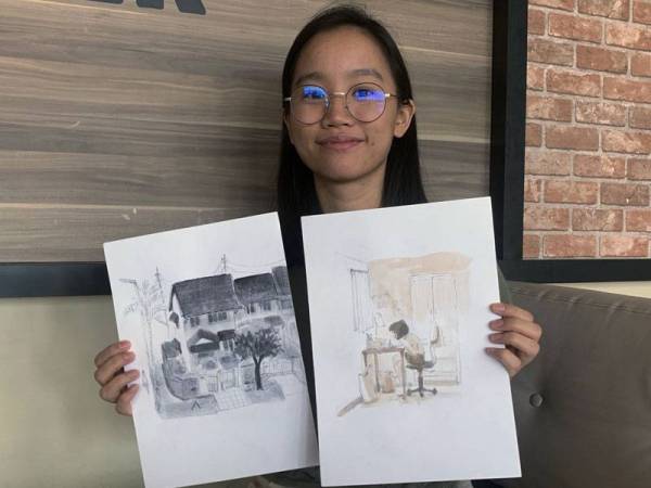 Erica menunjukkan hasil tangannya yang mengisahkan ‘Min’ watak berusia 20an dan bercita-cita menjadi juruanimasi berjaya mengharumkan nama Malaysia apabila berjaya menewaskan seramai 1,800 pelukis yang lain dari beberapa buah negara. - Foto Bernama