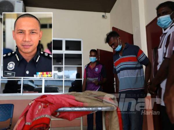 Jegathisan (kanan) menatap wajah anaknya sebelum dibawa pulang ke Kampung Koh, Sitiawan untuk disemadikan esok.
Gambar kecil: Nor Omar