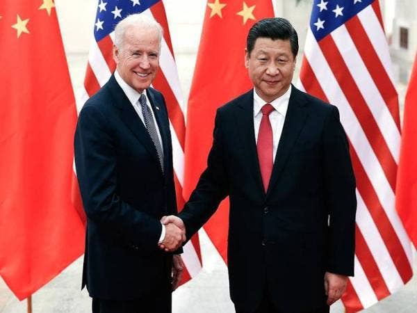 Biden (kiri) pernah mengkritik pemerintahan Presiden China, Xi Jinping dengan menganggapnya sebagai tidak demokratik. - Foto AFP