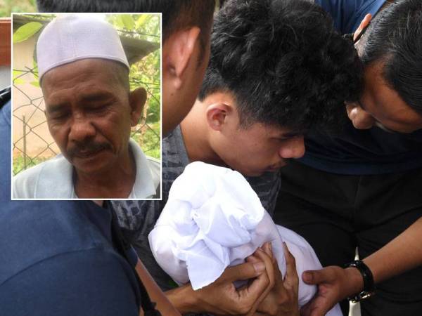 Pemain bola sepak kebangsaan, Muhammad Syafiq Ahmad, 25, (dua, kiri) memeluk jenazah anaknya di Unit Forensik Hospital Sungai Bakap, hari ini. - Foto Bernama, gambar kiri: Norain Shahadan