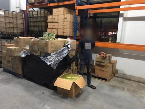 Antara lelaki yang ditahan dalam serbuan berkenaan.