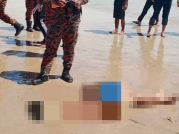 Muhamad Hariz yang lemas berjaya dijumpai oleh orang awam di Pantai Batu Layar, Kota Tinggi pada Selasa. - Foto: Ihsan Pembaca)