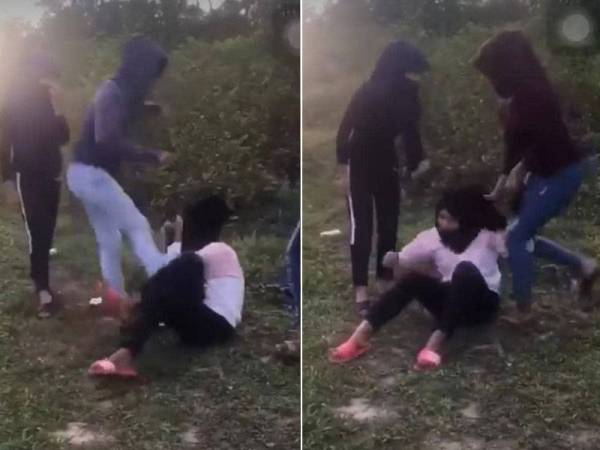 Video tersebut menunjukkan seorang remaja perempuan memukul dan menyepak mangsa sambil disaksikan rakan-rakannya.