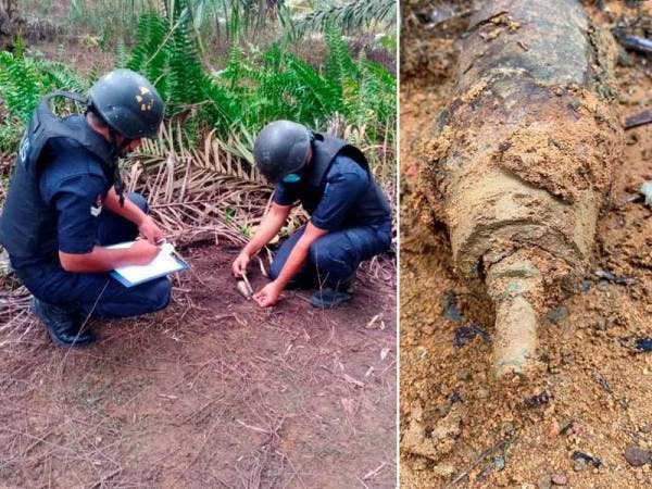 Anggota UPB mengukur bom lama yang ditemukan di kawasan ladang kelapa sawit di Felda Taib Andak, Kulai pada Ahad.