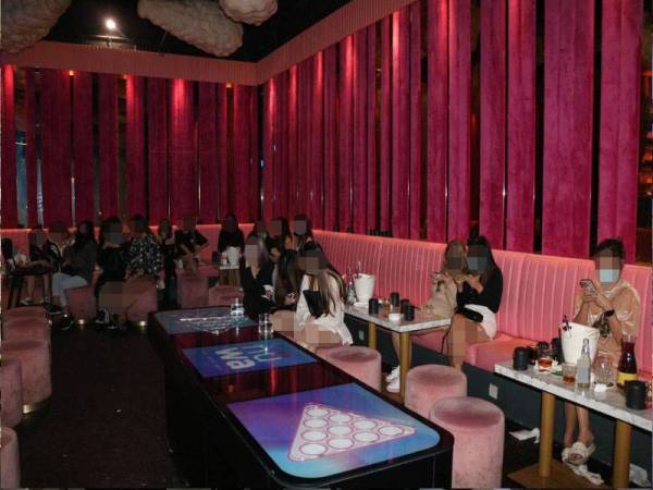 Antara individu yang dikompaun dalam serbuan di sebuah pusat hiburan di Sri Petaling Brickfields pada Sabtu.