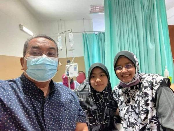 Muhammad Sanusi sempat bergambar dengan anaknya sebelum dibawa ke bilik pembedahan.