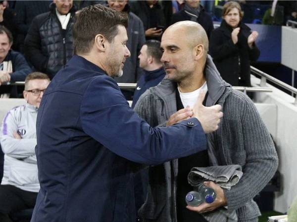 Pochettino (kiri) ketika mengemudi Tottenham Hotspur menyambut Guardiola ketika aksi suku akhir pertama Liga Juara-Juara di Stadium Tottenham Hotspur pada 9 April 2019.