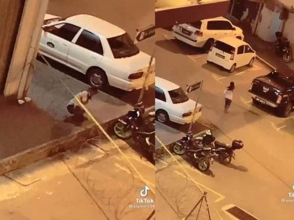 Tular gambar wanita menyusup keluar dari celah dawai berduri yang dipasang di kawasan PKPD Bandaran Berjaya, Kota Kinabalu.