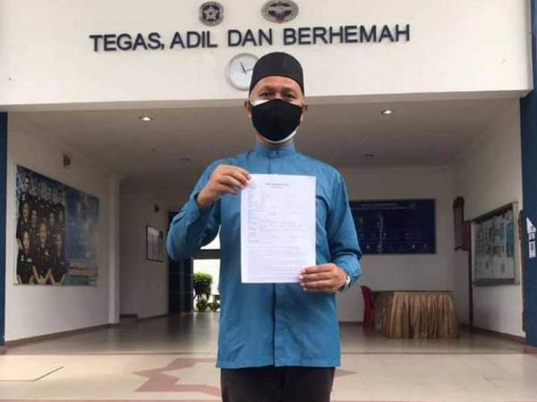 Rosmin menunjukkan laporan yang dibuat di Balai Polis Daerah Seremban 2 pada Selasa.