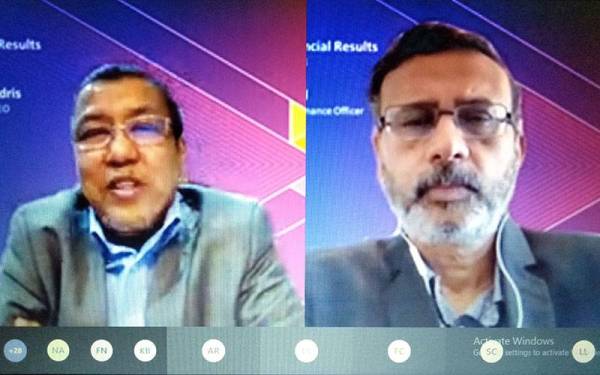 Izzaddin (kiri) dan Vivek semasa sesi pembentangan keputusan kewangan suku kedua 2021 secara maya pada Jumaat.