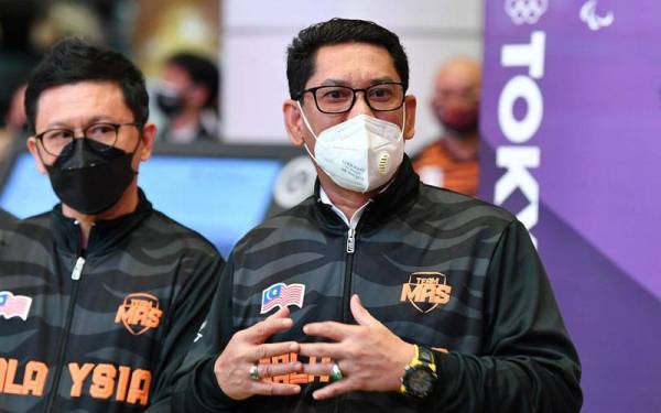 Ahmad Faizal pada sidang media ketika hadir menyambut kepulangan kelompok terakhir kontinjen Malaysia di KLIA pada Isnin. - Foto Bernama