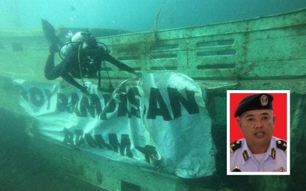 Sebuah bot asing yang ditenggelamkan di Pulau Redang, Besut untuk dijadikan tukun tiruan. - Foto ihsan Maritim Malaysia Terengganu (Gambar kecil: Muhammad Suffi)