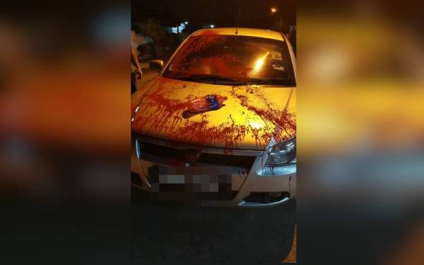 Kereta milik Jian Boon yang disimbah cat merah dalam kejadian pada Khamis.