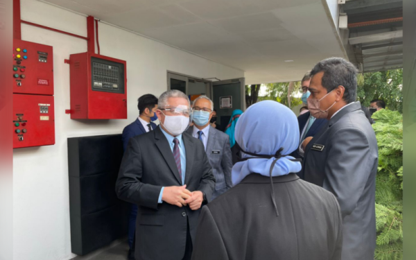 Dr Adham ketika mengadakan lawatan kerja di Malaysian Vaccine and Pharmaceutical Sdn Bhd, Puchong pada Selasa.