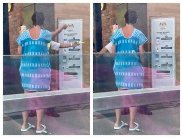 Wanita tersebut dirakam ketika ditahan daripada memasuki sebuah pasar raya di Bangsar.